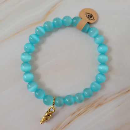 Armband mit natürlichem Cat's Eye Stein – hellblau / türkis - goldener Elefant