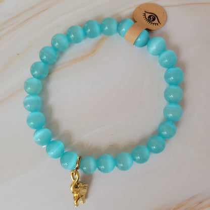 Armband mit natürlichem Cat's Eye Stein – hellblau / türkis - goldener Elefant